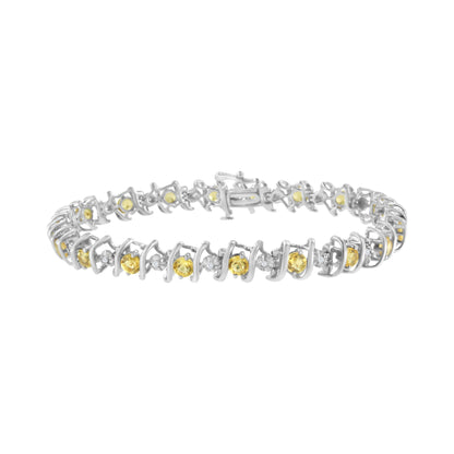 White metal bracelet with alternating round yellow gemstones in prong settings and round white gemstones in miracle settings, shown from a slightly elevated front angle.