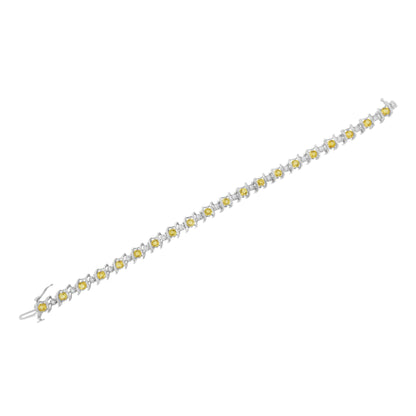 White metal bracelet with alternating round yellow and white gemstones set along its length, shown flat from an angled top-down view.