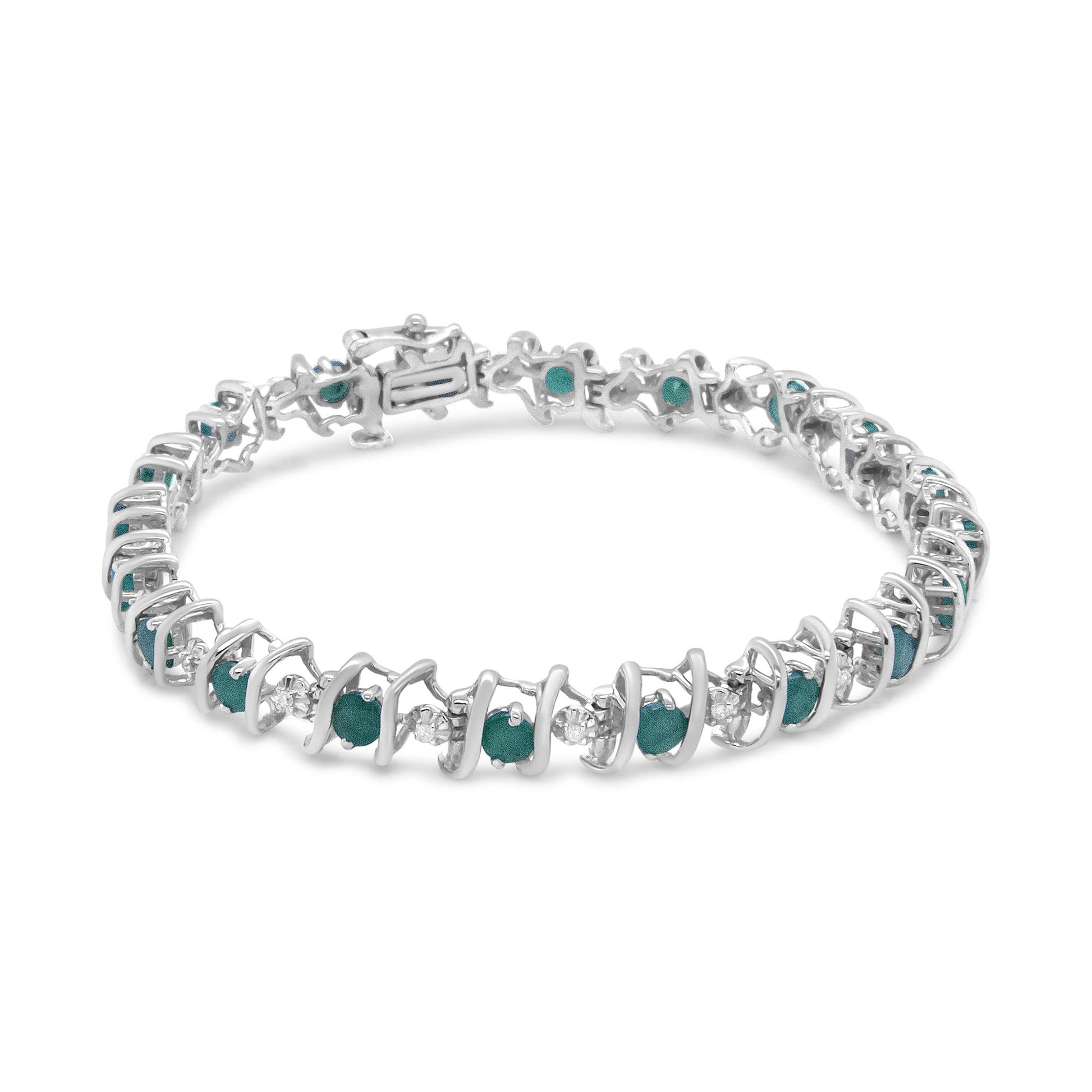 Close-up front angle of a white metal bracelet featuring alternating round white and green gemstones in prong settings.
