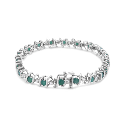 White metal bracelet with alternating round green and white gemstones in prong settings, shown in a front angled view.