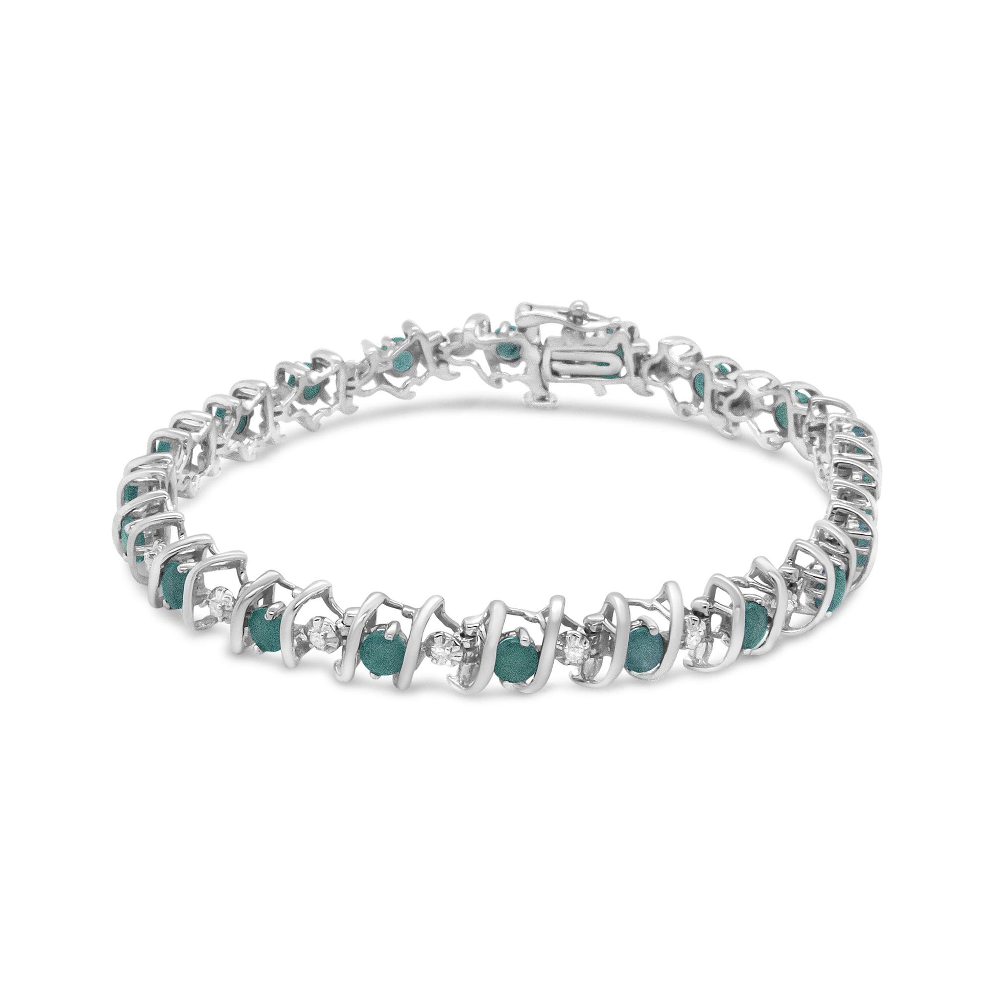 White metal bracelet with alternating round green and white gemstones in prong settings, shown at a slight angle on a white background.