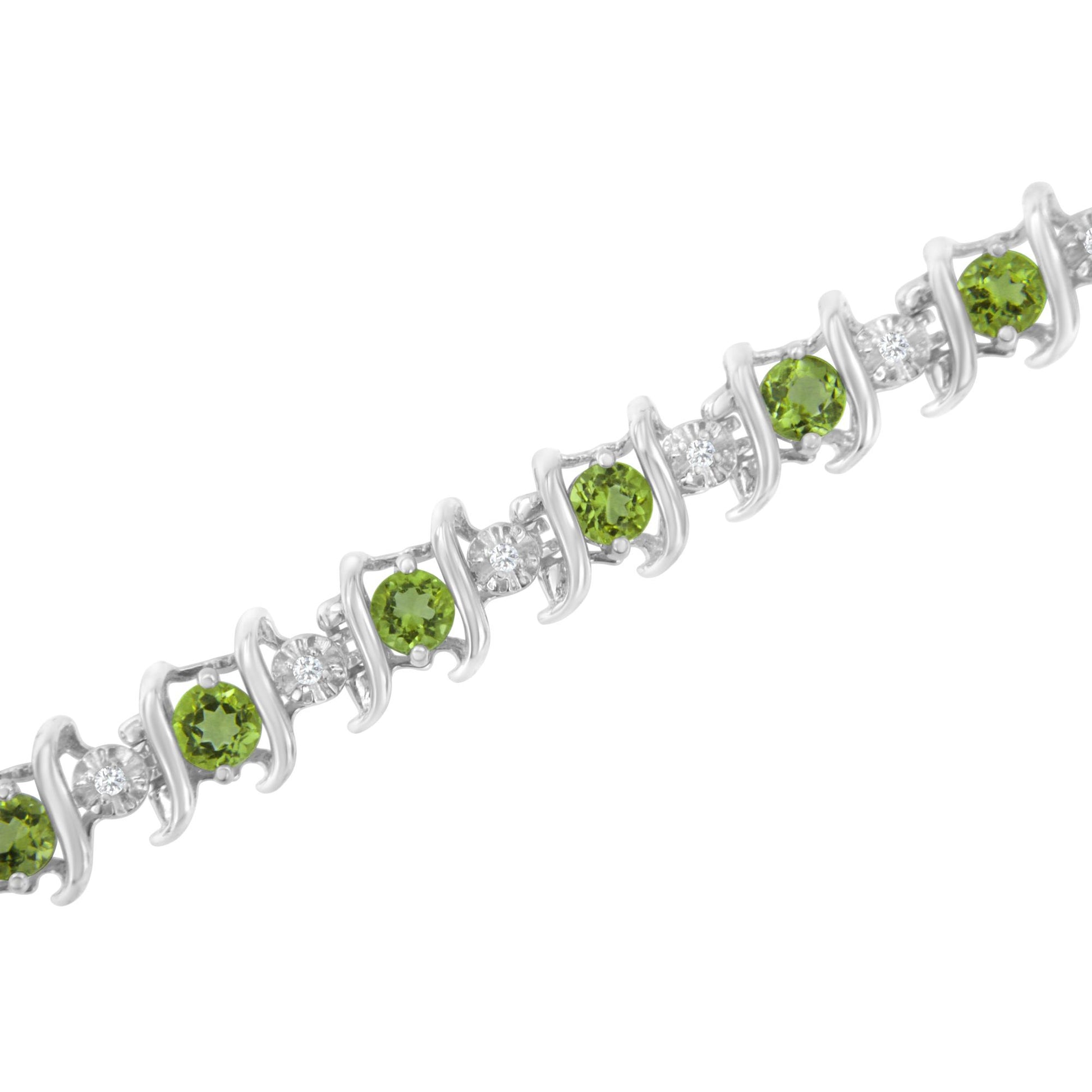 White metal bracelet featuring alternating round green gemstones and round white gemstones in a miracle and prong setting, shown in a close-up angled view.