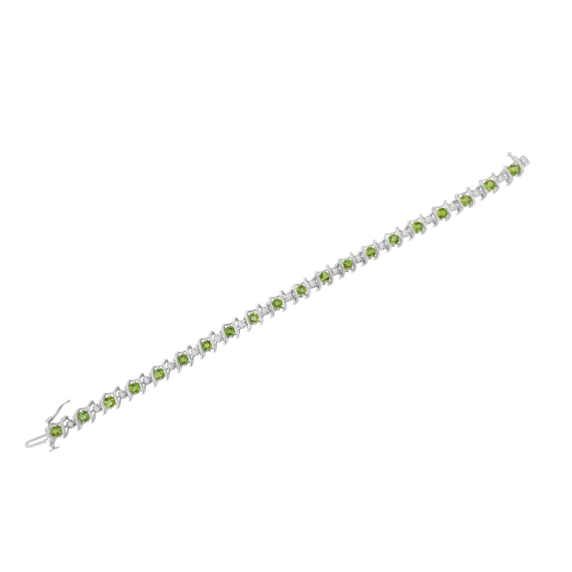 White metal bracelet with alternating round white gemstones in miracle setting and green gemstones in prong setting, shown in a top-down view.