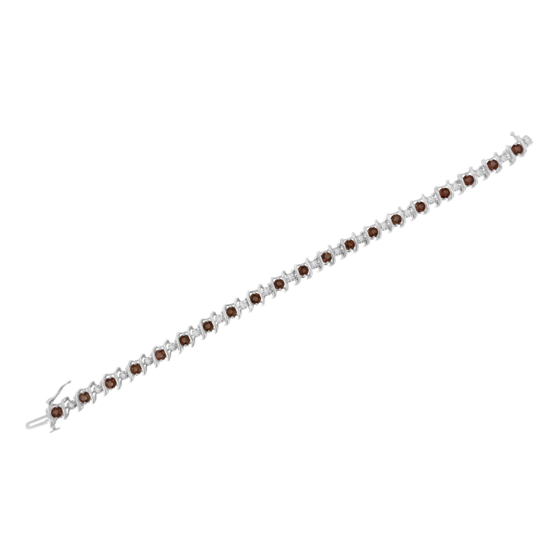 White metal bracelet with alternating round white gemstones in miracle settings and round red gemstones in prong settings, shown in a flat lay angled view.