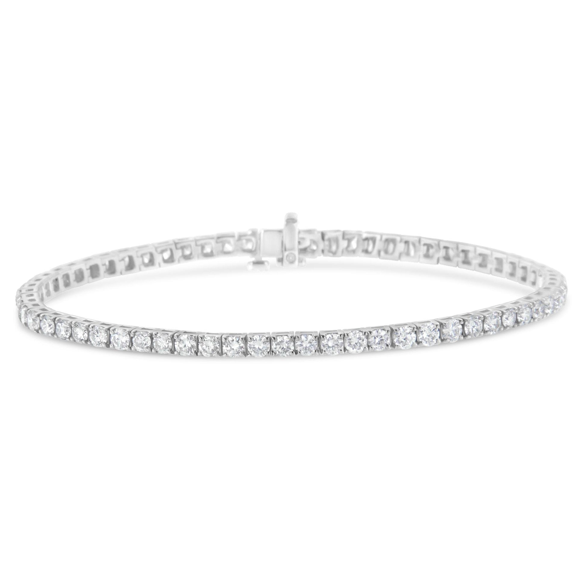 White metal tennis bracelet with round white gemstones in prong settings, shown from a slightly angled front view.