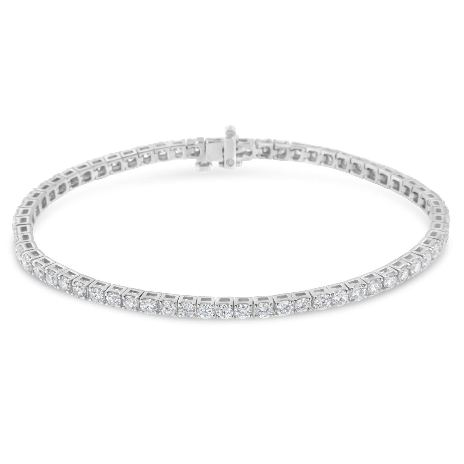 White metal bracelet with round white gemstones in prong settings, shown from a slightly elevated front angle.