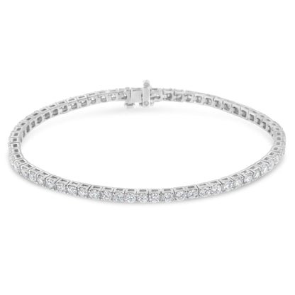 White metal bracelet with round white gemstones in prong settings, shown from a slightly elevated front angle.