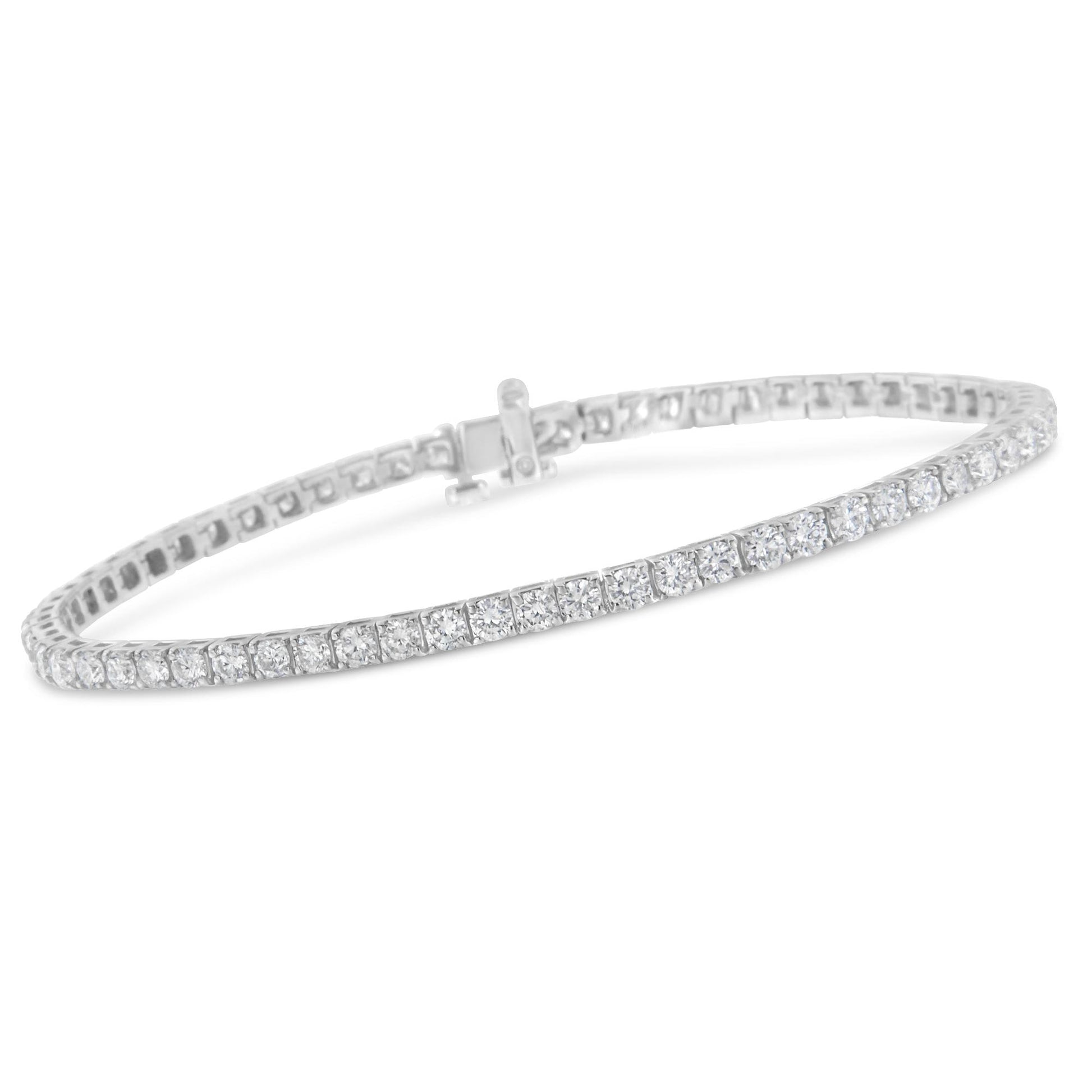 White metal bracelet with a continuous row of round white gemstones in prong settings, shown at a slight angle.