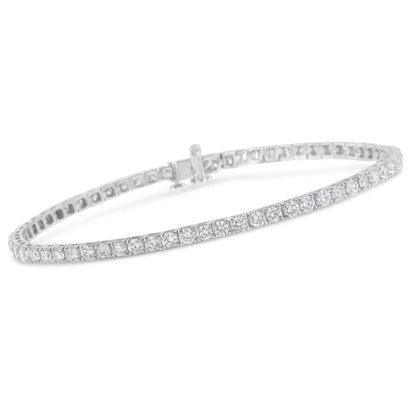 White metal bracelet with a continuous row of round white gemstones in prong settings, shown at a slight angle.