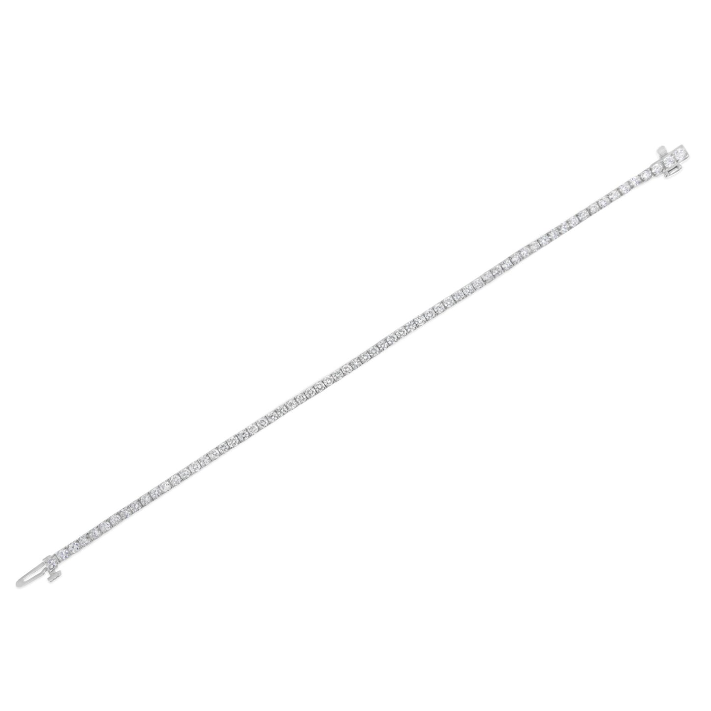 Bracelet with a continuous line of round white gemstones set in prongs, shown flat on a white background, angled diagonally.
