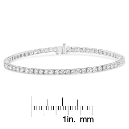 White metal bracelet with round white gemstones in prong settings, shown in a front-facing angle above a ruler for size reference.