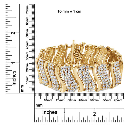 Yellow bracelet with alternating smooth and wavy links set with round white gemstones, shown from a front angle on rulers for size reference.