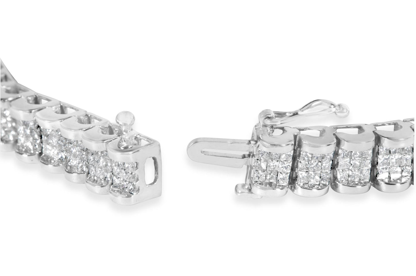 Close-up angled view of a white bracelet with multiple clusters of small princess-shaped white gemstones in an invisible setting, showing the clasp mechanism.