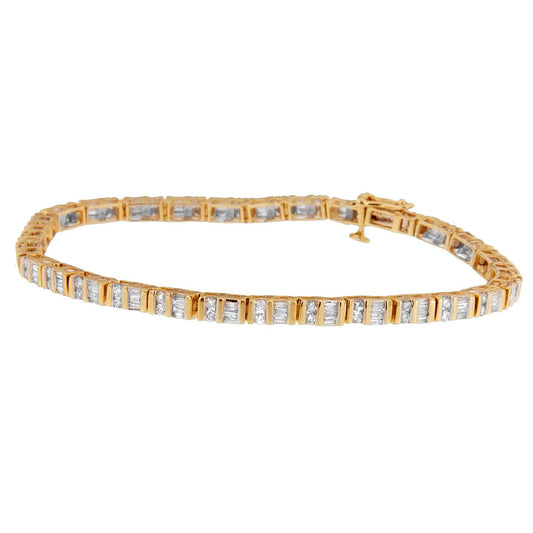 Yellow metal bracelet with alternating channel-set white round and baguette-shaped gemstones, shown from a side angle.