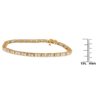 Yellow metal bracelet with alternating round and baguette white gemstones in channel settings, shown flat on a white background with a ruler for size reference, angled slightly from the side.