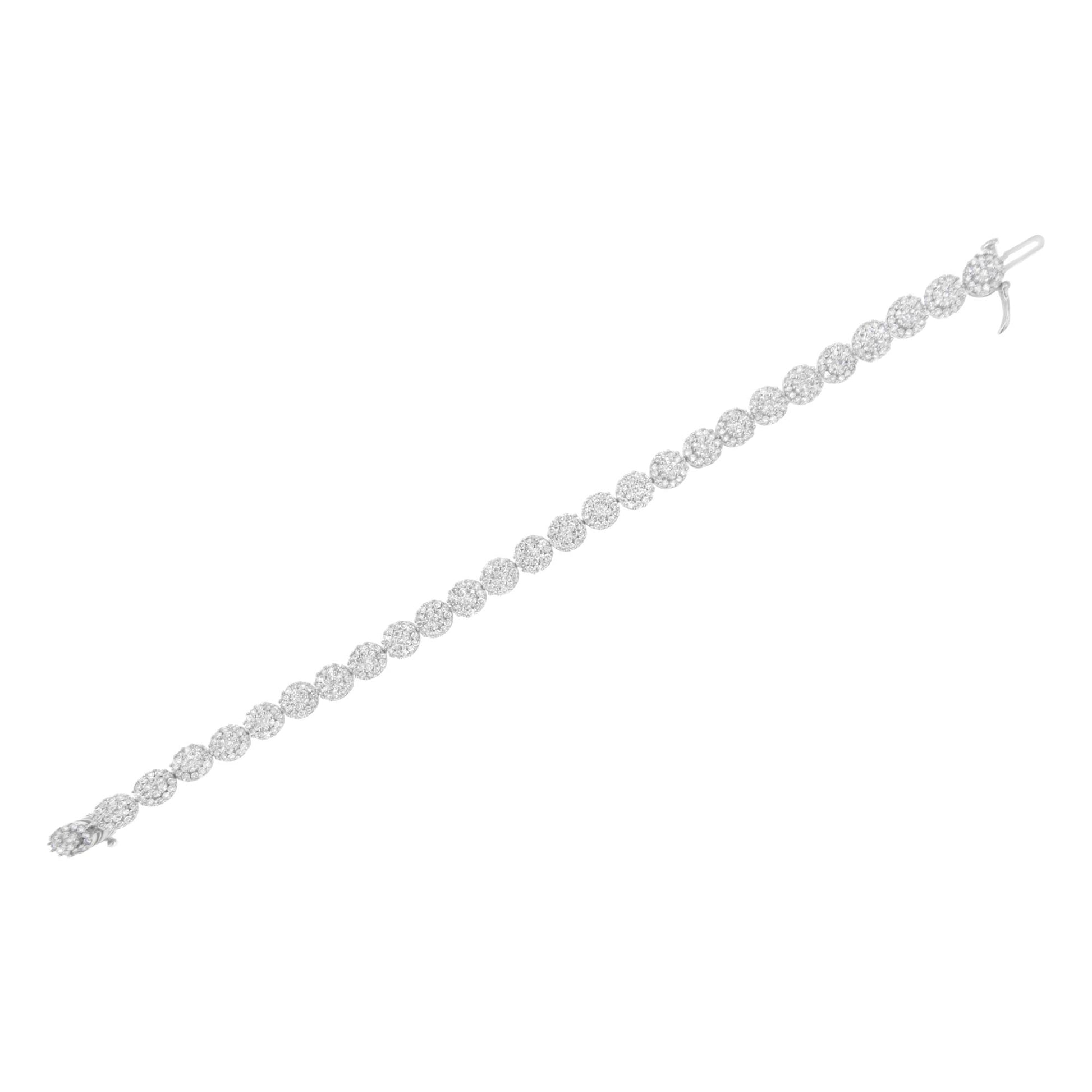 White metal bracelet with round white gemstones in prong settings, shown from a top diagonal angle.