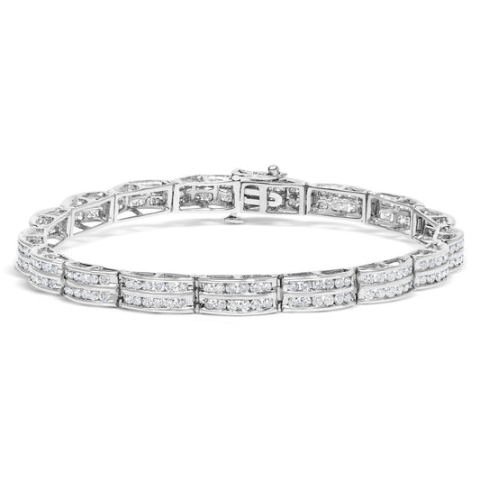 White metal bracelet with rows of round white gemstones in a channel setting, shown from a front angle.