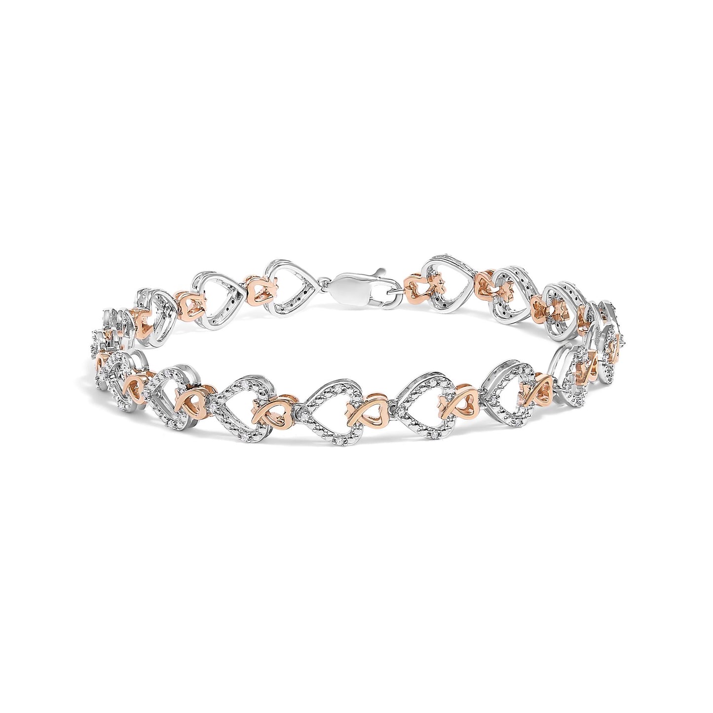 Bracelet shown from a front angle with alternating white and rose metal linked heart shapes, white pave-set round gemstones on white metal hearts.