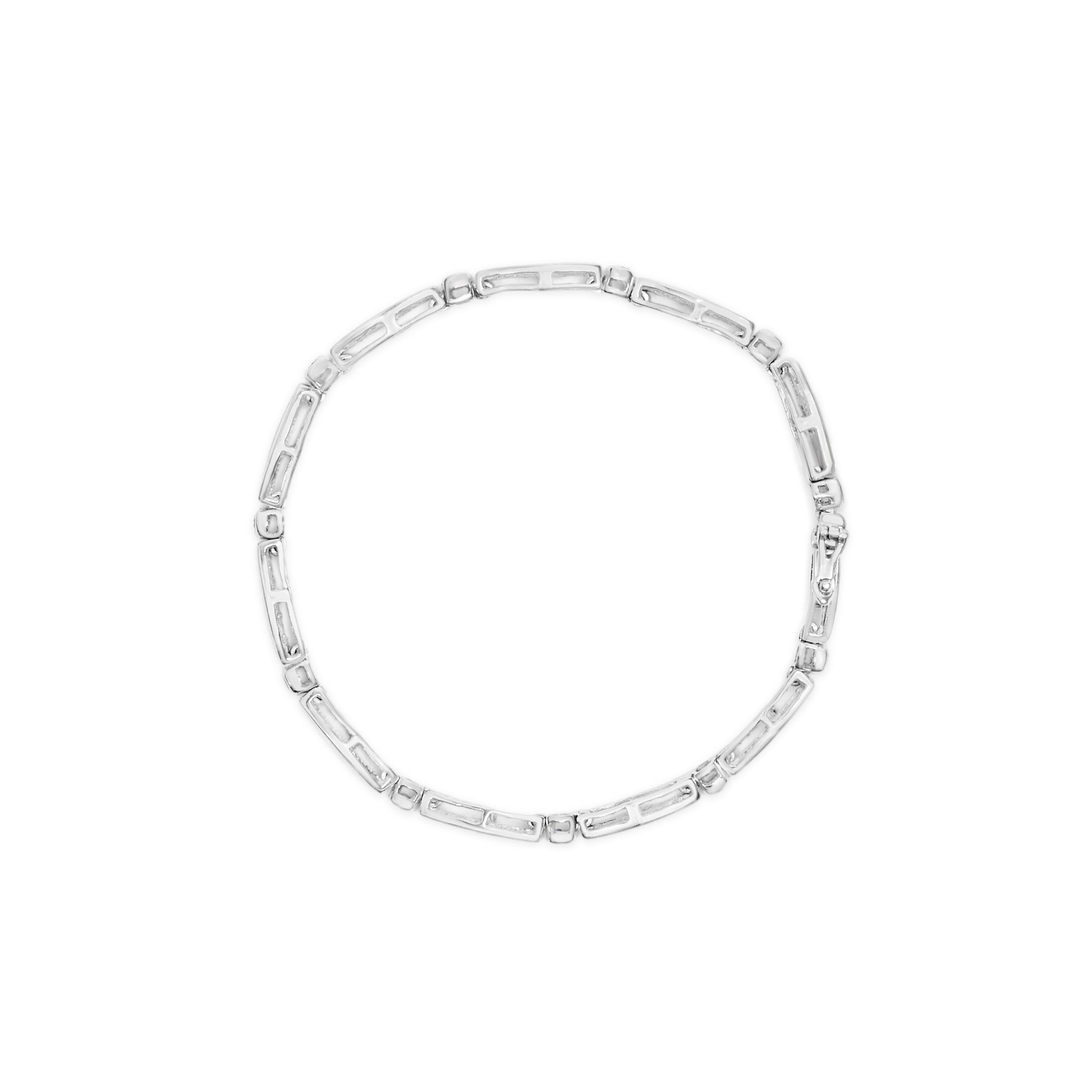 Top view of a white metal bracelet with alternating rectangular and small round links, featuring channel-set baguette-shaped and bezel-set round white gemstones.