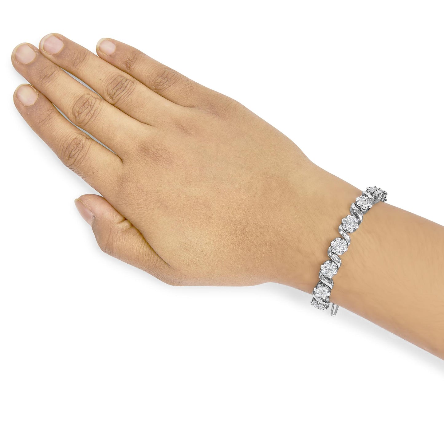 White metal bracelet with round white gemstones in prong setting, worn on a model's wrist, shown from above.