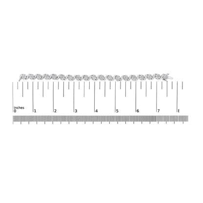 White metal bracelet with round white gemstones in prong settings, shown from top view on a ruler for size reference.