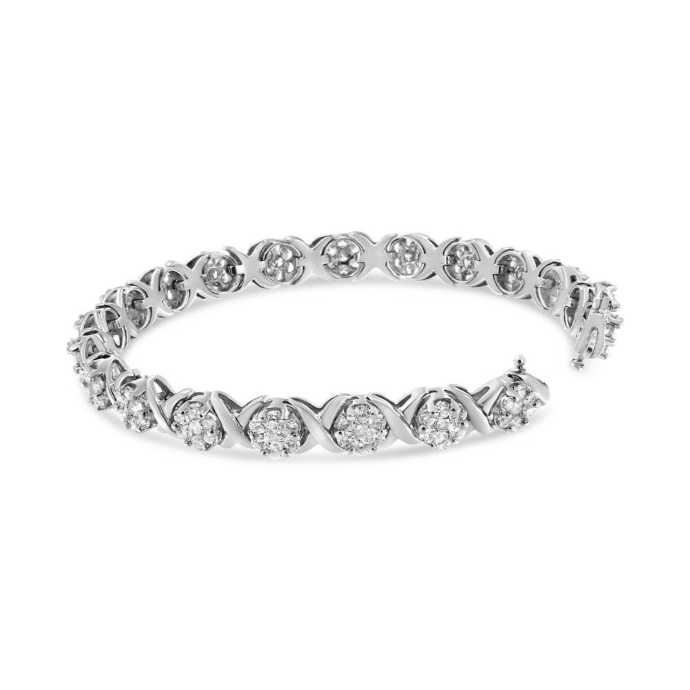 White metal bracelet with round white gemstones in prong settings arranged in an alternating pattern, shown at a slight angle on a white background.