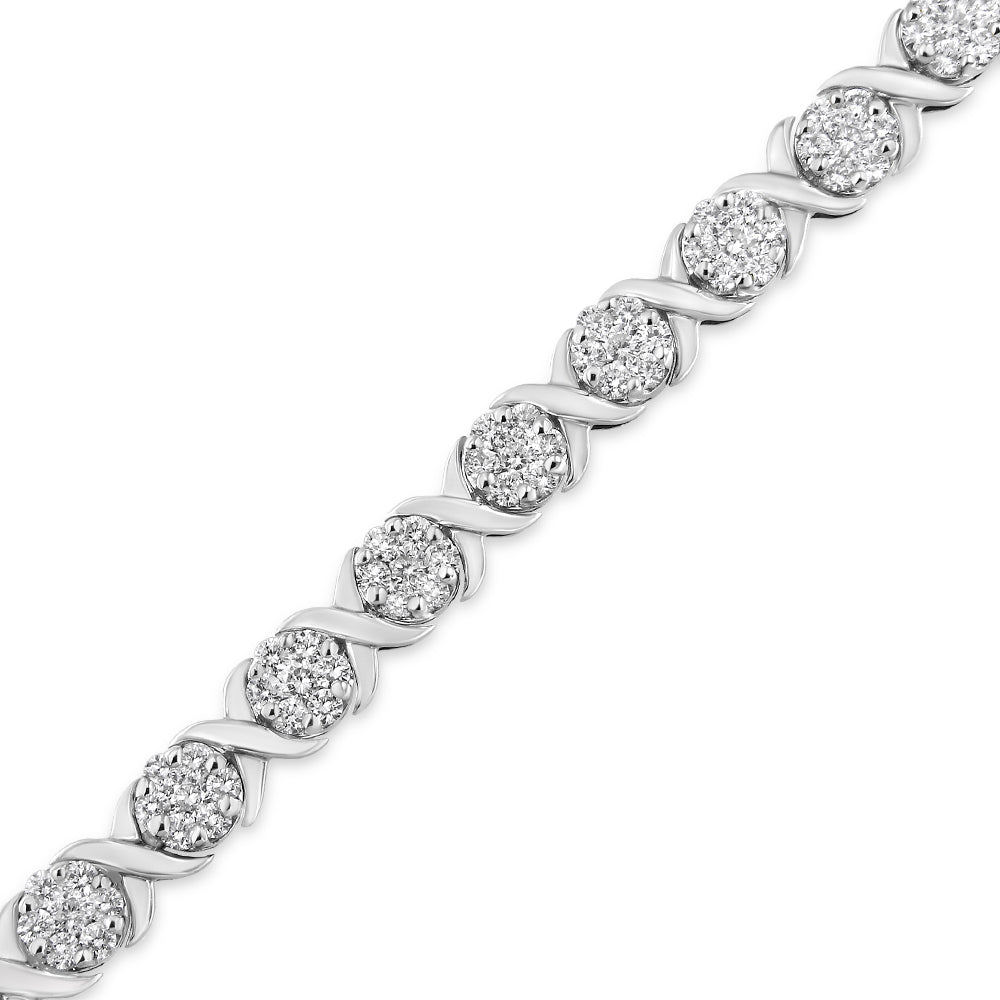 Diagonal close-up of a white metal bracelet featuring clusters of round white gemstones in prong settings alternating with curved metal links.