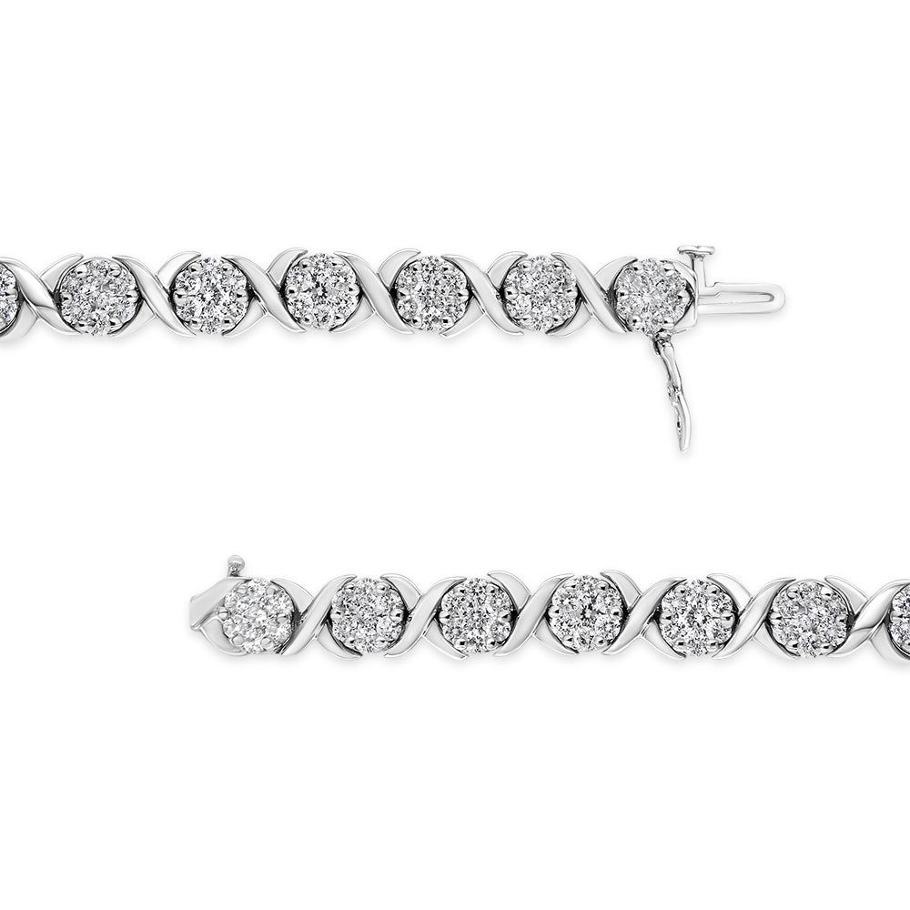 Close-up top-down view of a white metal bracelet featuring round white gemstones in prong settings alternating with smooth curved links.