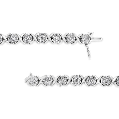 Close-up top-down view of a white metal bracelet featuring round white gemstones in prong settings alternating with smooth curved links.