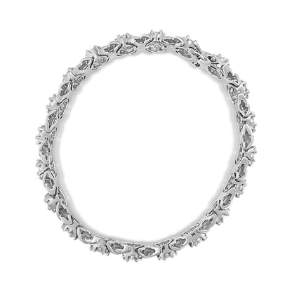 Top-down view of a white bracelet featuring a continuous row of round white gemstones in prong settings forming a circular shape.