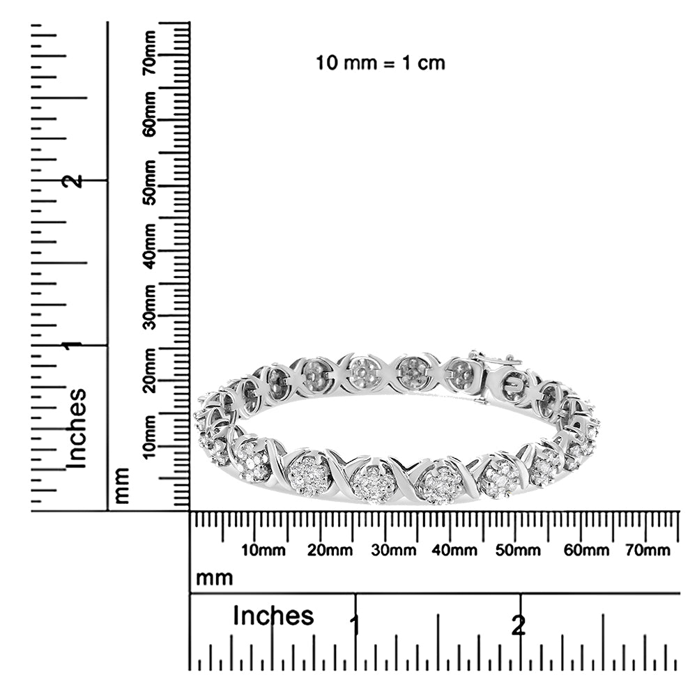 White metal bracelet with round white gemstones in prong settings, shown flat on a ruler for size reference, front angle.