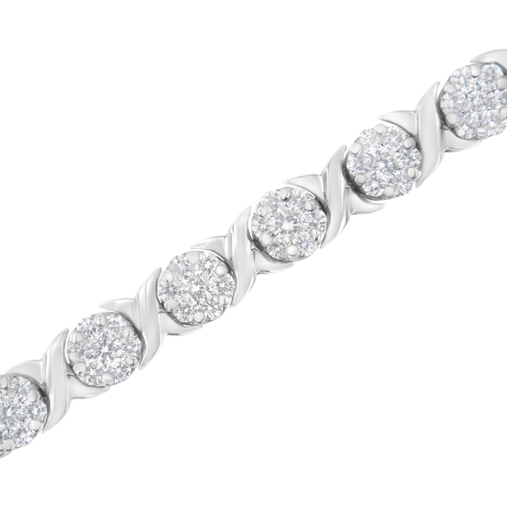 Close-up diagonal view of a white metal bracelet featuring round white gemstones in prong settings with alternating swirl design links.