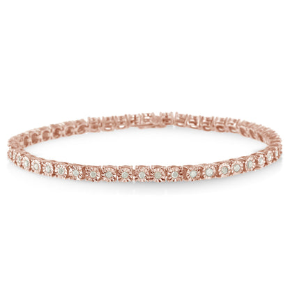Close-up angled view of a rose-colored bracelet set with round white gemstones in a miracle setting.