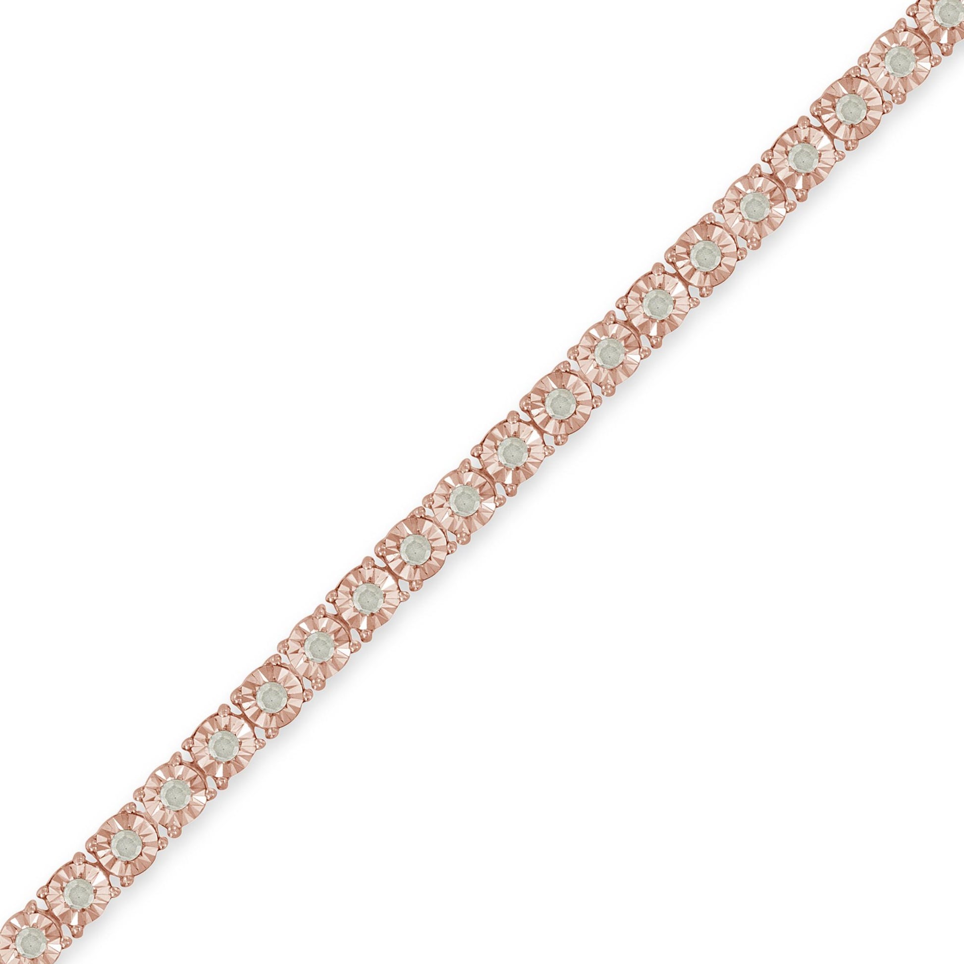 Rose metal bracelet with round white gemstones in miracle setting, shown in a diagonal close-up view.