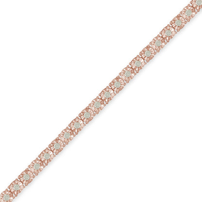 Rose metal bracelet with round white gemstones in miracle setting, shown in a diagonal close-up view.