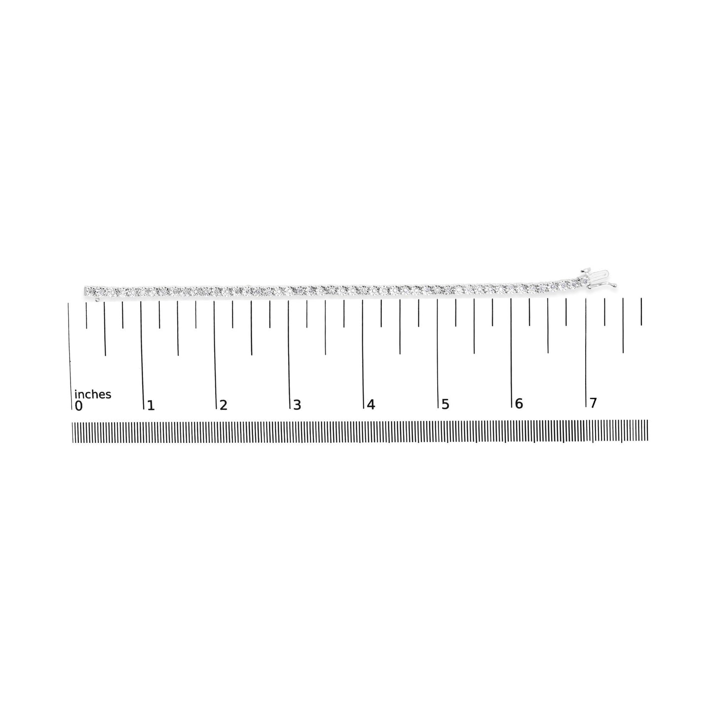 Top-down view of a white bracelet with round white gemstones in miracle setting, placed on a ruler for size reference.