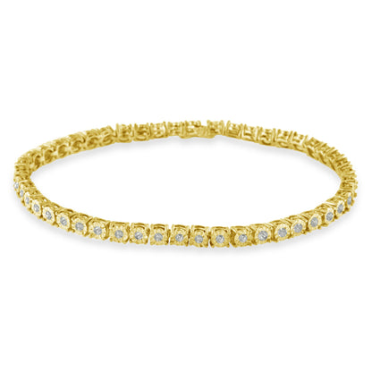 Yellow metal bracelet with round white gemstones in miracle setting viewed from a slightly elevated front angle.