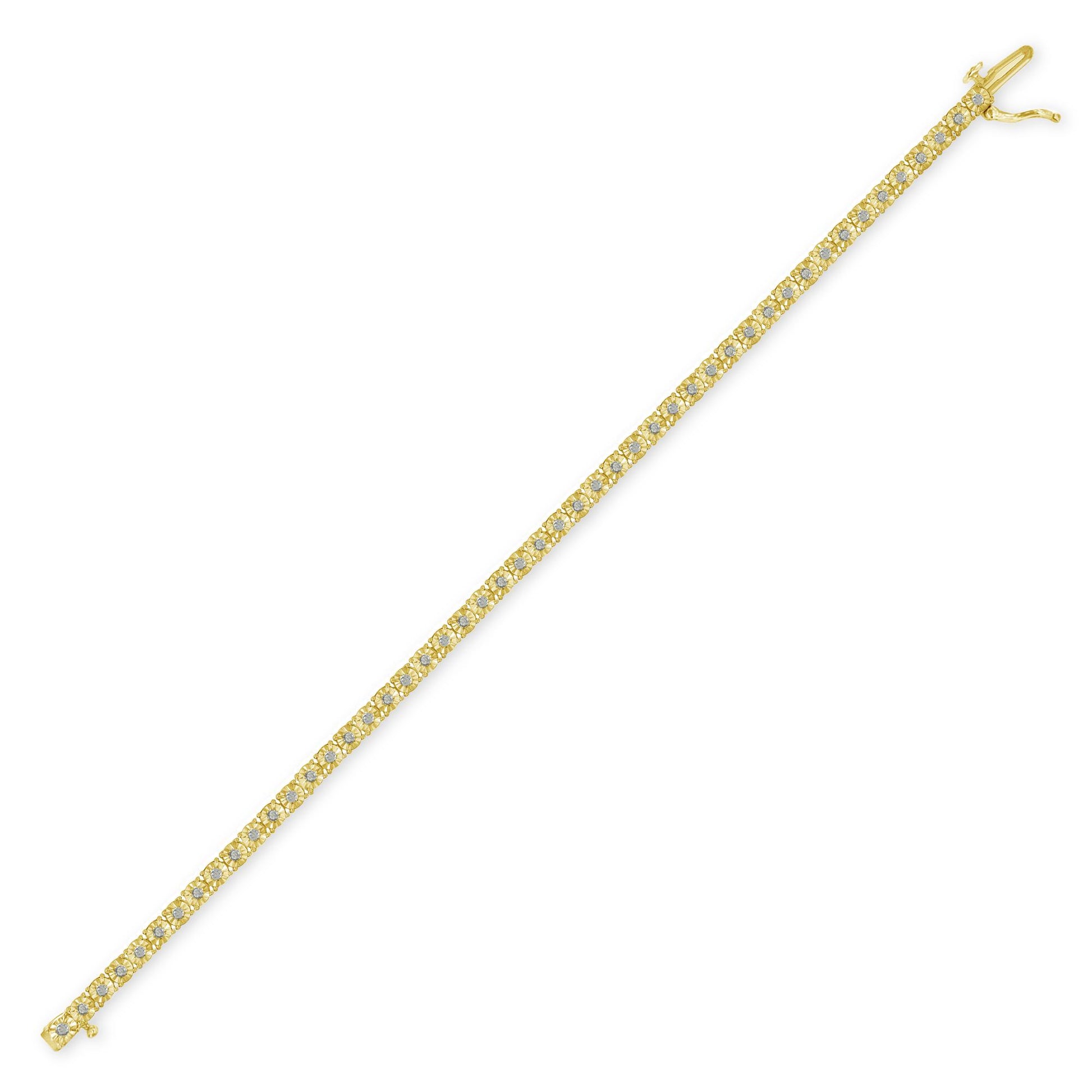Yellow metal bracelet with round white gemstones in a miracle setting, shown from a top diagonal angle.