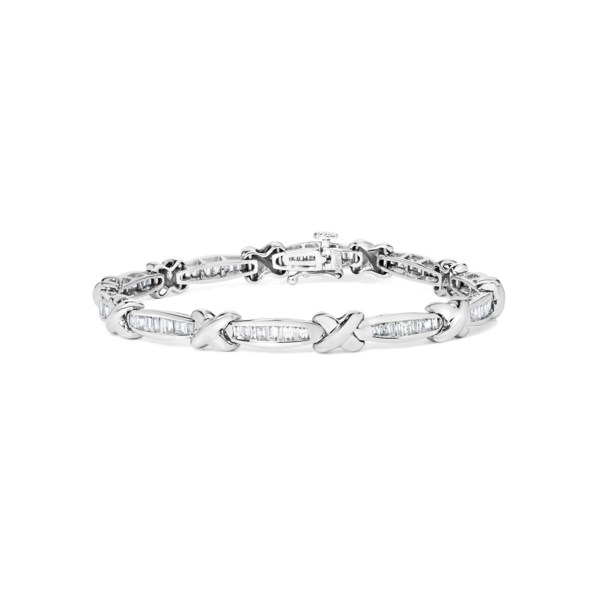 White metal bracelet with alternating X-shaped links and elongated sections set with white baguette-shaped gemstones, shown from a front angle.