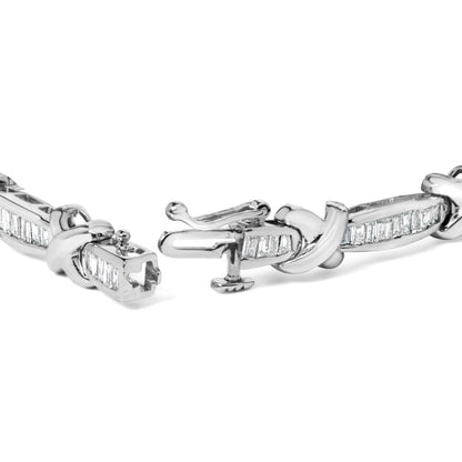 Close-up angle of a white metal bracelet with baguette-shaped white gemstones in a channel setting and a detailed clasp.