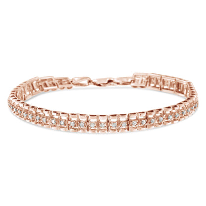 Rose metal bracelet with two rows of round white gemstones in prong settings, shown at a slight top front angle.