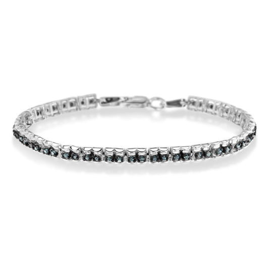 White metal bracelet with prong-set round blue gemstones, shown in a front angled view.