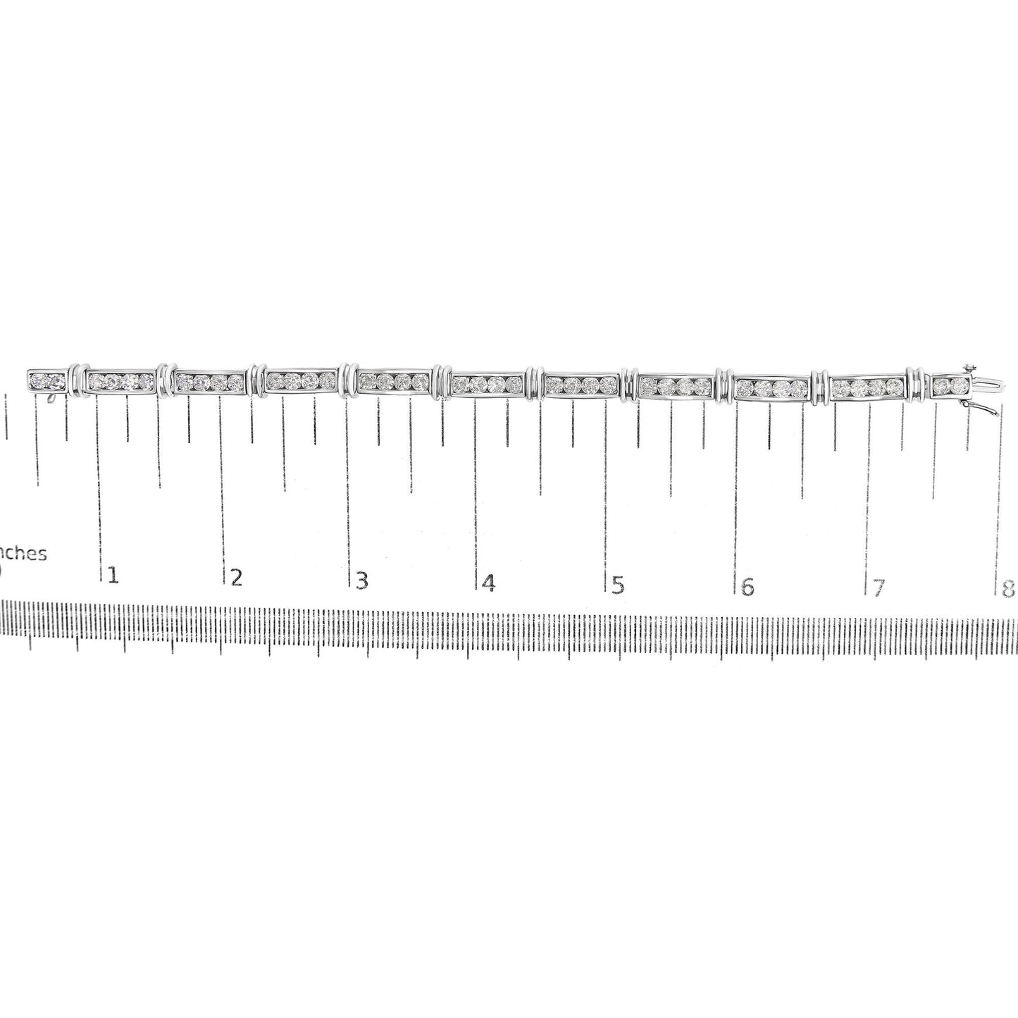 White bracelet with rectangular links set with round white gemstones in a channel setting, shown flat on a scale, top-down angle.