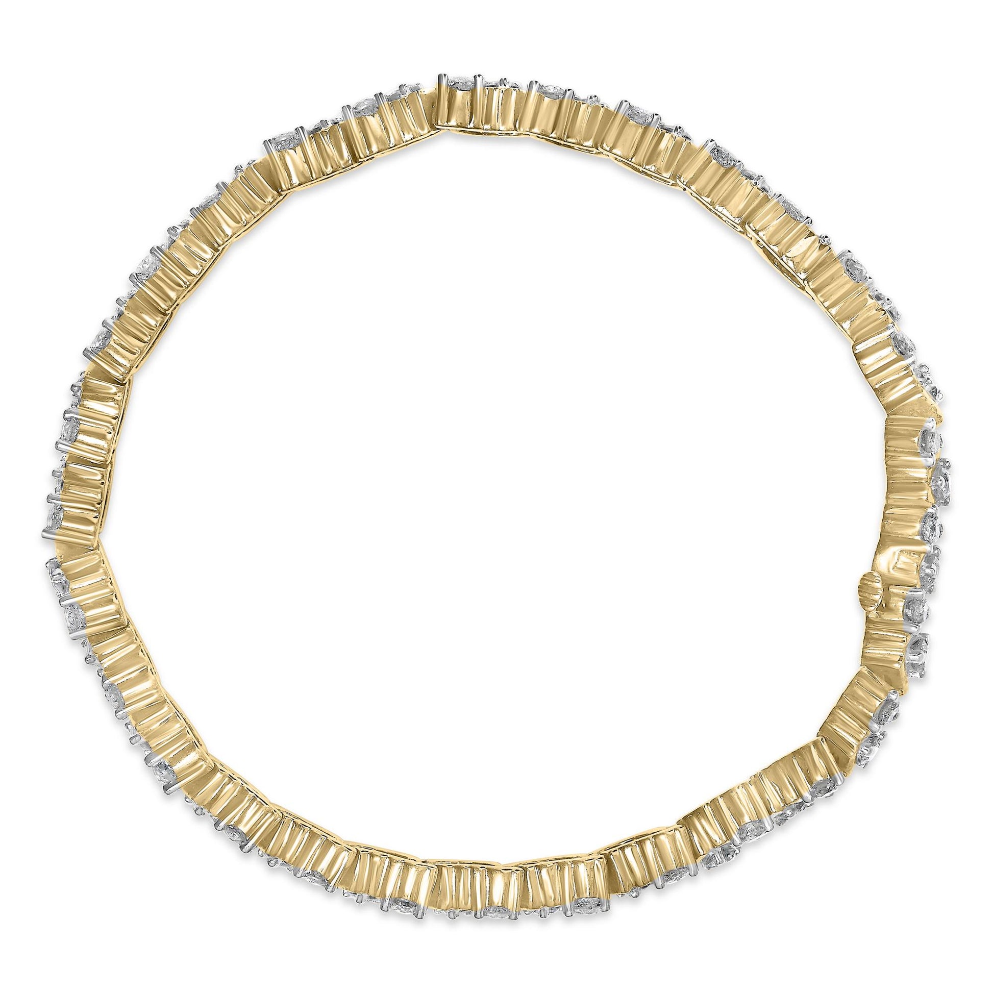 Top-down view of a yellow metal bracelet with round white gemstones in three-prong settings encircling the band.