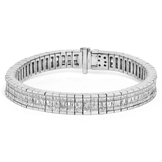 Close-up front angle of a white metal bracelet with rows of rectangular and square white gemstones in channel and invisible settings.
