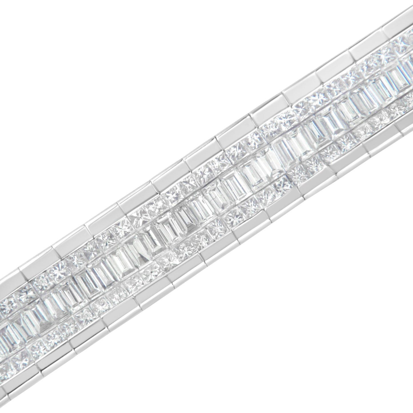 Close-up angled view of a white metal bracelet featuring rows of white baguette-shaped gemstones in channel setting and white princess-shaped gemstones in invisible setting.