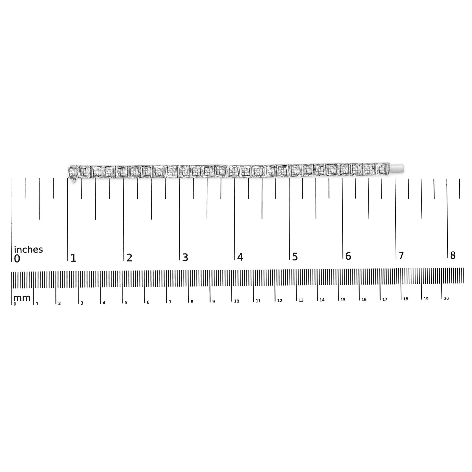 Bracelet with white metal and multiple square white gemstones in an invisible setting, shown flat on a dual scale with inch and millimeter measurements, top-down view.