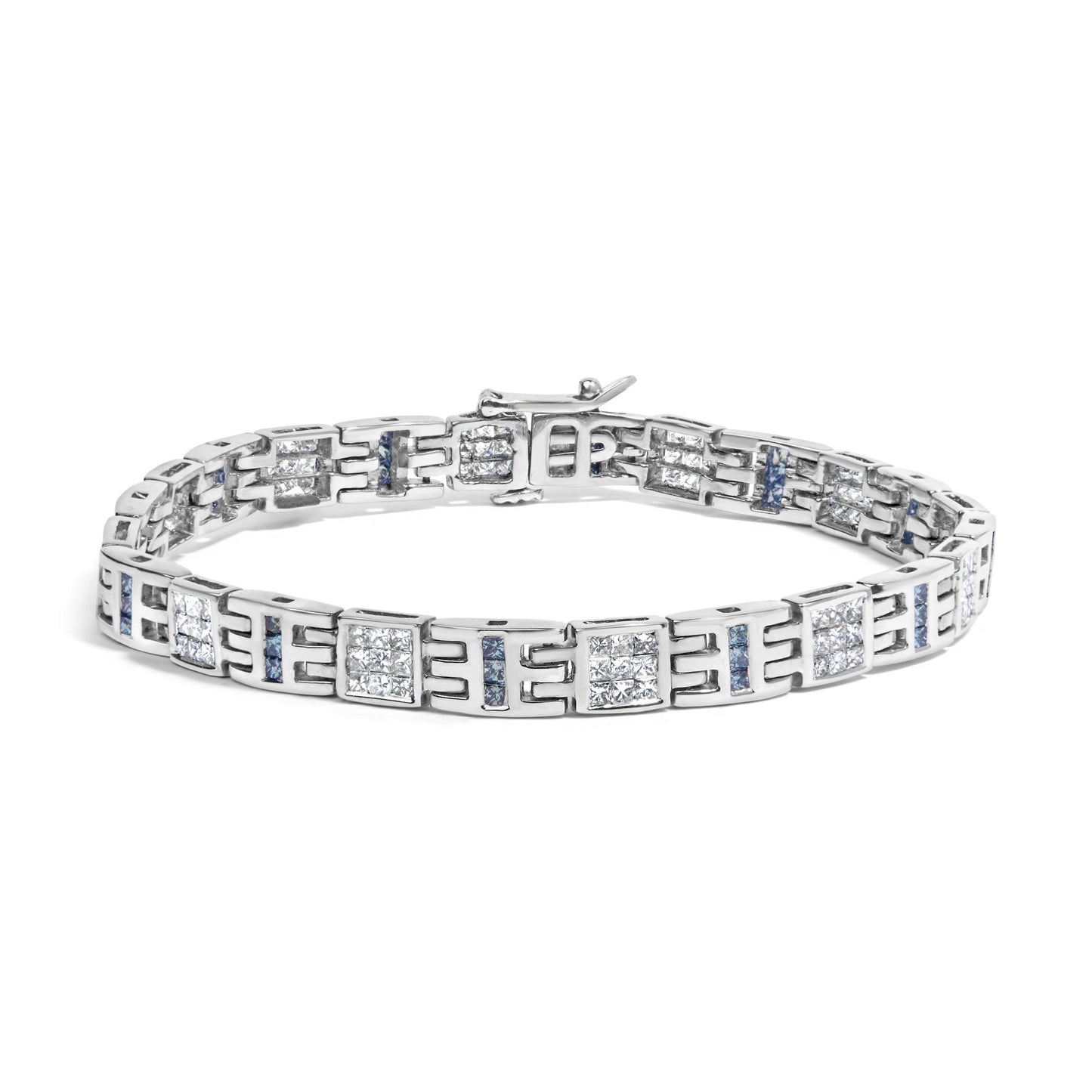 White metal bracelet with alternating square clusters of white gemstones in invisible setting and vertical rows of blue gemstones in channel setting, shown from a front angled view.
