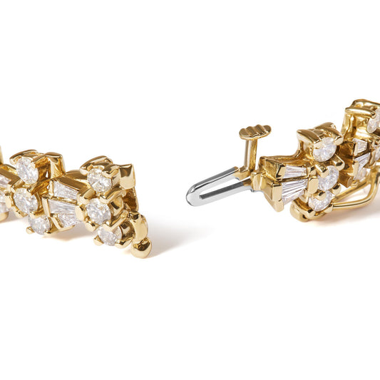 Close-up front angle of a yellow metal bracelet featuring round and baguette white gemstones with prong and channel settings, shown open with visible clasp mechanism.