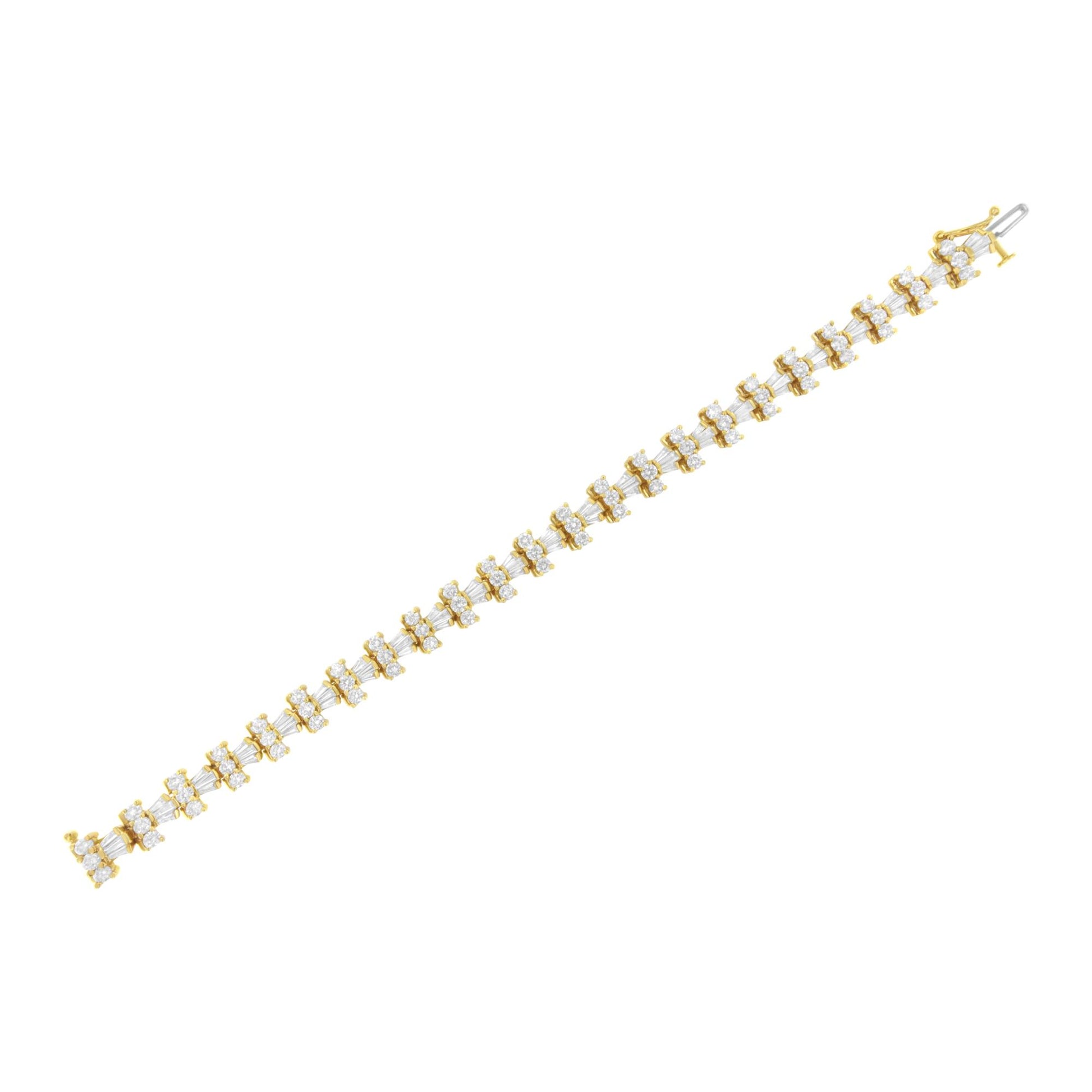 Yellow bracelet with alternating round white gemstones in prong settings and baguette white gemstones in channel settings, shown in a flat lay angled shot.
